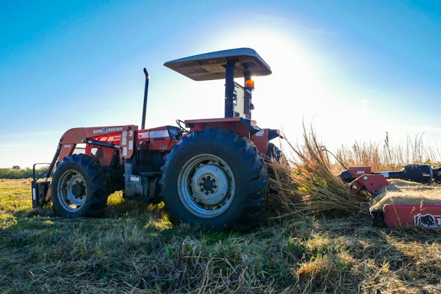 Blue tractor farming equipment for rural property